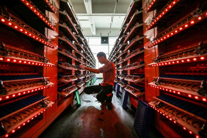 A worker on the production line of a lithium-ion battery factory in Huaibei, China