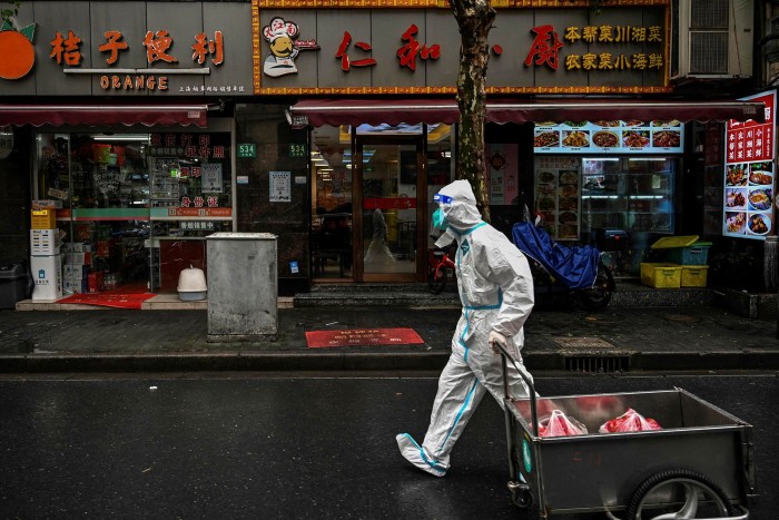 A worker wearing a protective gear in Shanghai earlier this week