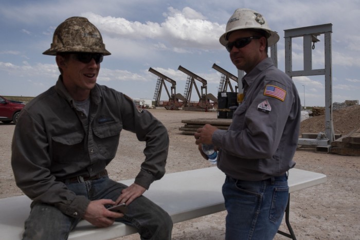 Workers at an oil rig in Midland, Texas