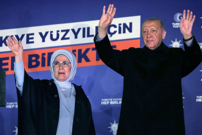 Recep Tayyip Erdoğan and his wife waving to supporters