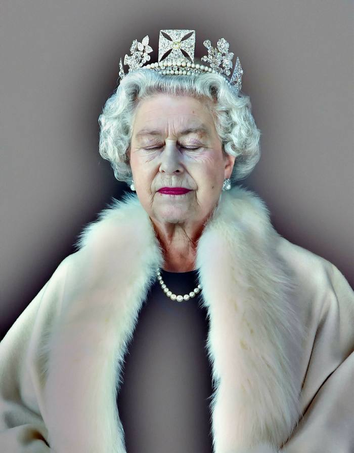 Portrait of the Queen, closed-eyed, wearing a tiara and white fur, surrounded by a halo-like halo