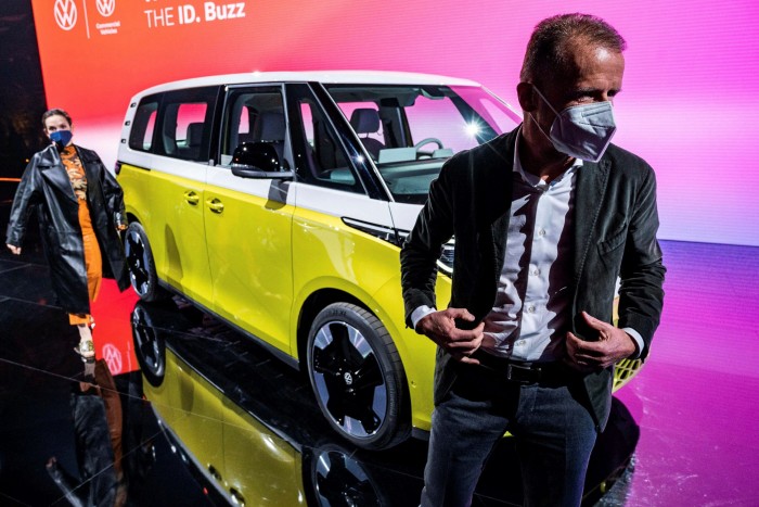 Volkswagen chief executive Herbert Diess poses in front of the new ID Buzz electric van during an unveiling event in Hamburg this month