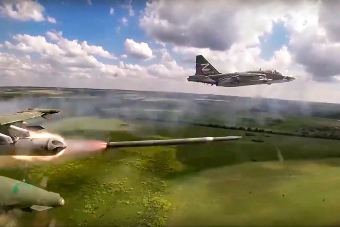 A Russian Sukhoi Su-25 ground attack jet fires rockets on a mission at an undisclosed location in Ukraine