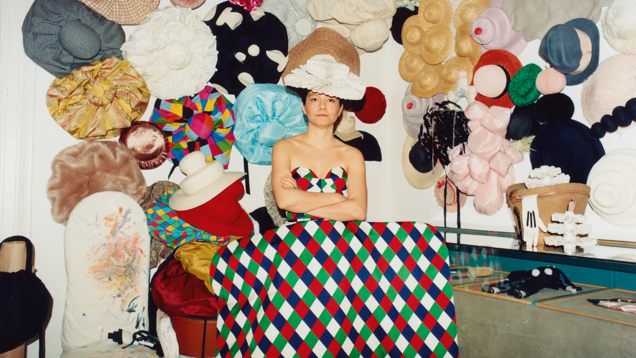 Maryam Keyhani at home in Berlin, with headpieces from her archives