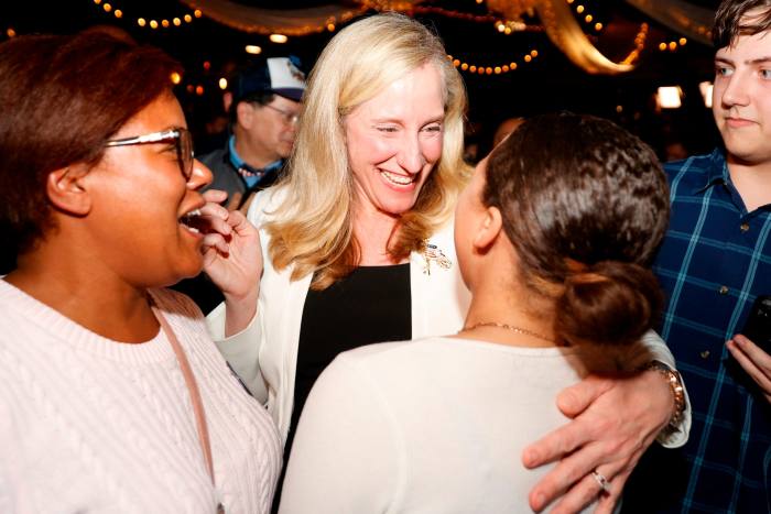 Abigail Spanberger embraces supporters during an election night party
