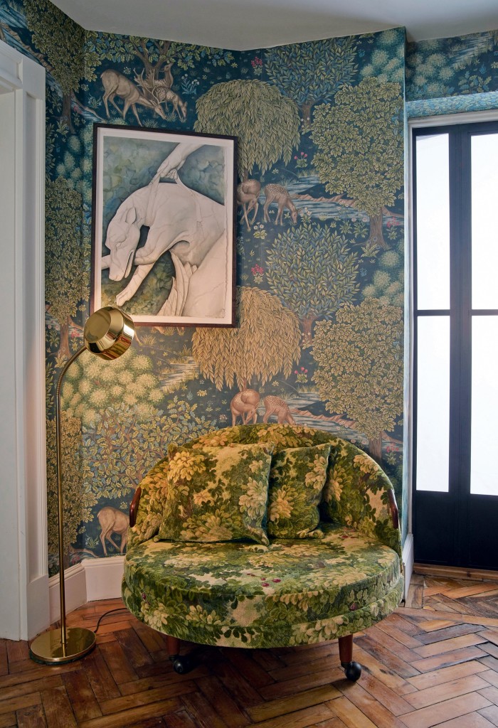 A love seat covered with verdure tapestry in a Bloomsbury home designed by Rachel Chudley