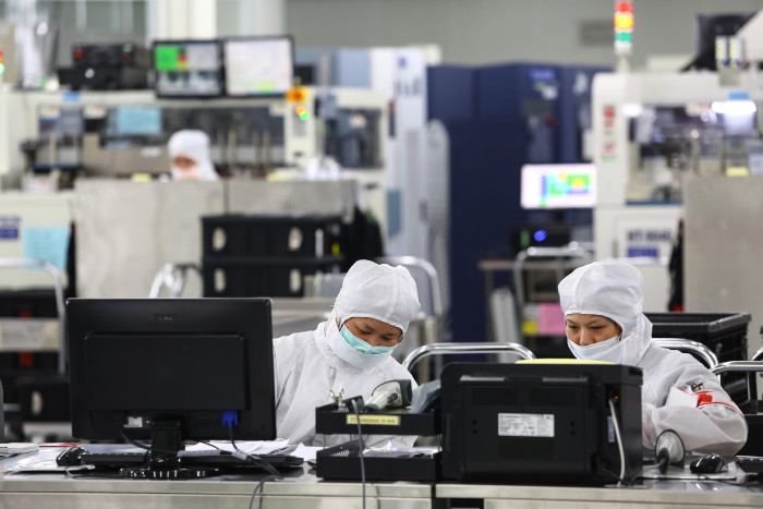 Workers at Siliconware Precision Industries factory in Taiwan