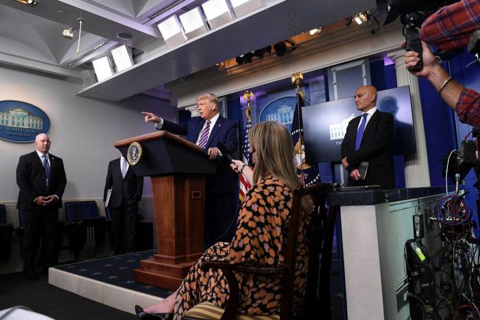 Donald Trump holds a press conference, flanked by Moncef Slaoui (R), chief adviser to Operation Warp Speed, in September