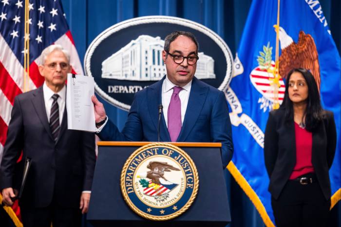US assistant attorney general Jonathan Kanter, centre, joins attorney general Merrick Garland and associate attorney general Vanita Gupta to announce the suit against Google 