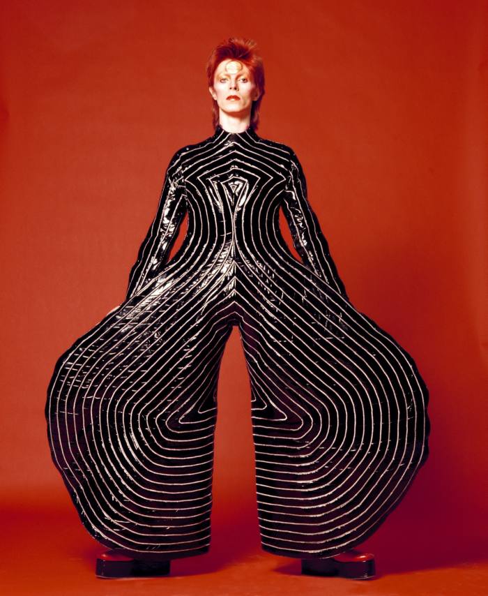 David Bowie wears the striped bodysuit designed by Kansai Yamamoto for the 1973 Aladdin Sane tour