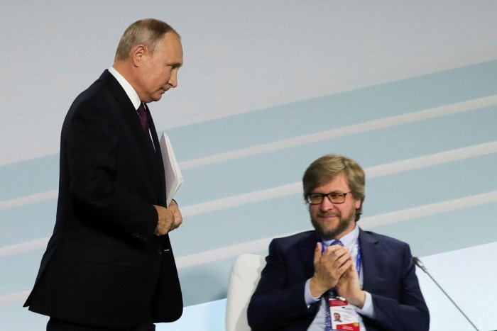 President Vladimir Putin and Valdai Club research director Fyodor Lukyanov attend the plenary session of the 16th annual meeting titled “The Dawn of the East and the World Political Order” in 2019