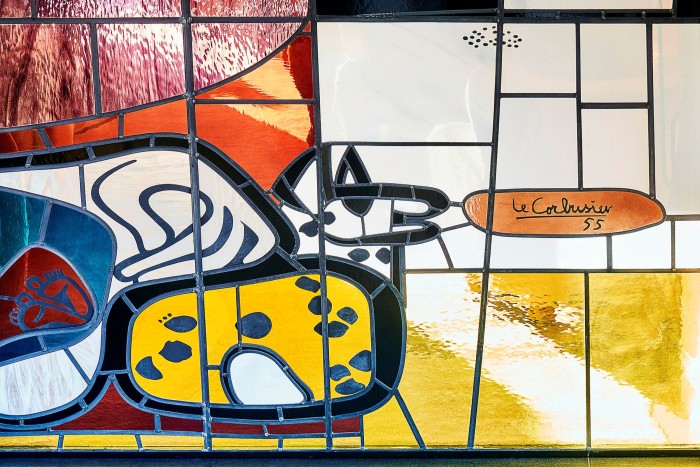 A stained glass window in the reception area, after a tapestry by Le Corbusier at Château La Coste