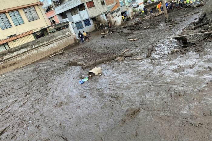 The damage caused to a street after flooding at La Gasca neighbourhood of Quito, Ecuador