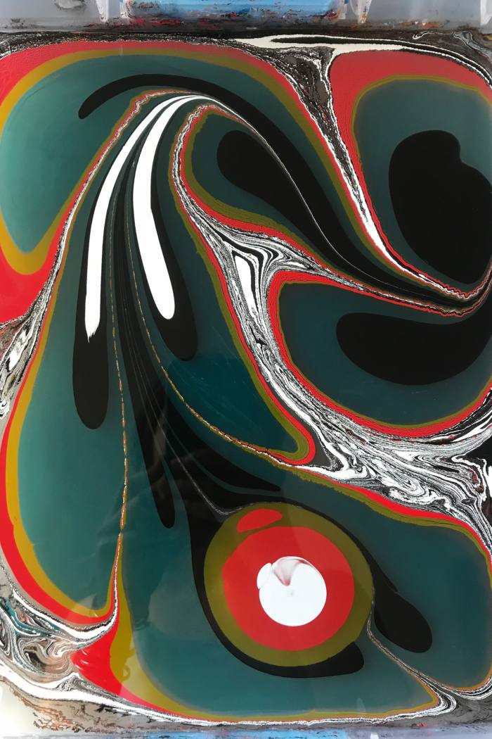 A design on the surface of artist Mercedez Rex’s marbling tray