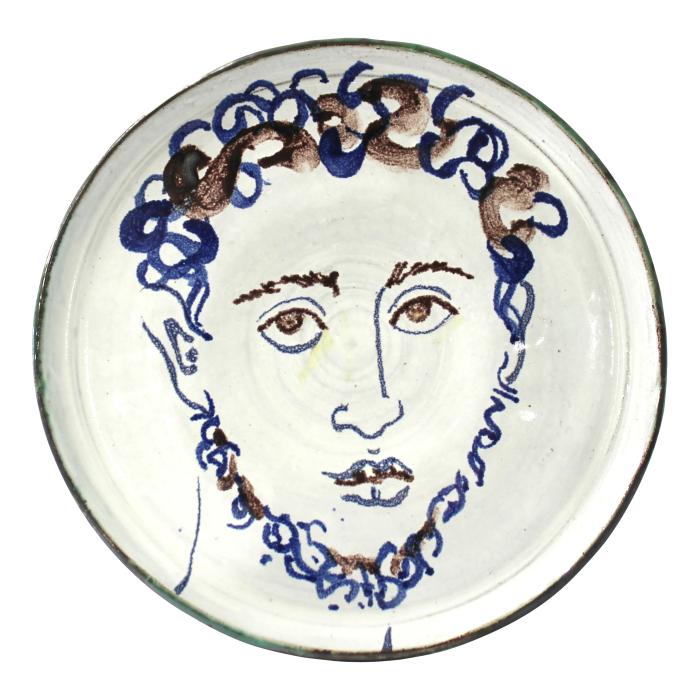 face of a man painted on a plate