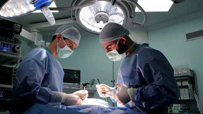 two surgeons in an operating room