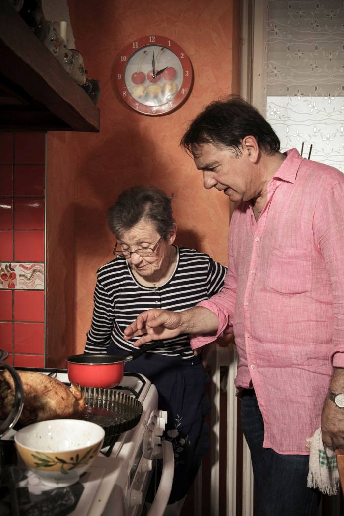 Raymond Blanc and elderly his mother stand at the stove in the family in France in 2013