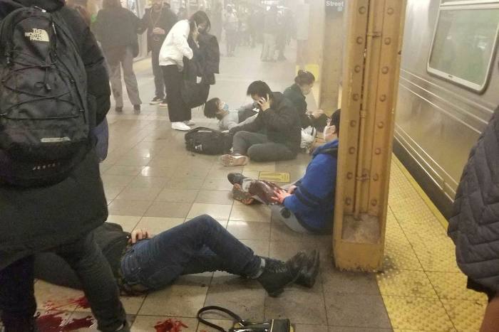 People lie wounded at the 36th Street subway station