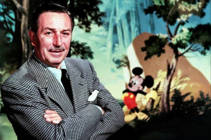 Walt Disney with his cartoon creation Mickey Mouse