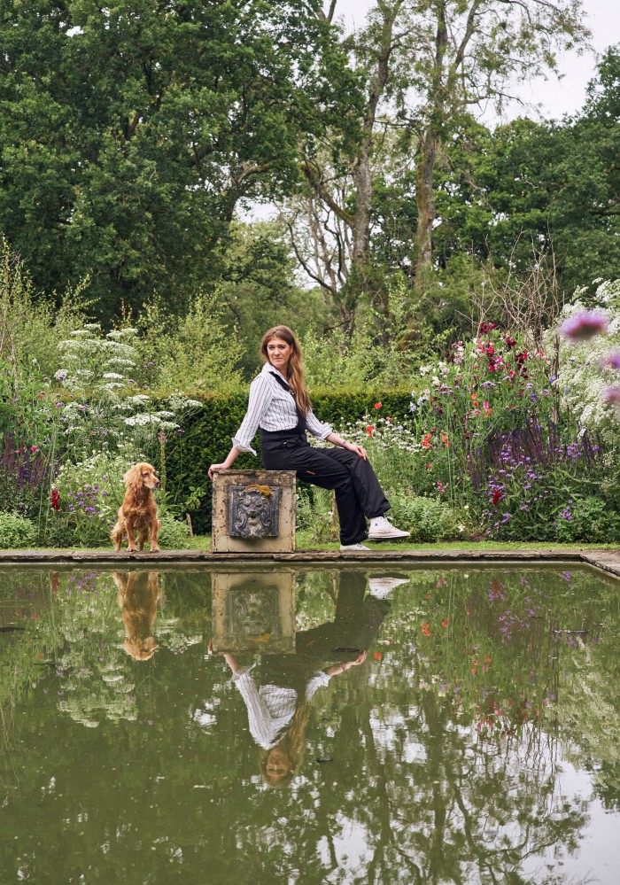Flora Soames at home in Wiltshire, with her dog Humbug