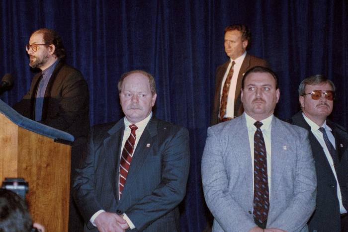 Salman Rushdie, surrounded by security guards, speaks at Columbia University in 1991 — his first public appearance outside the UK following the 1989 fatwa