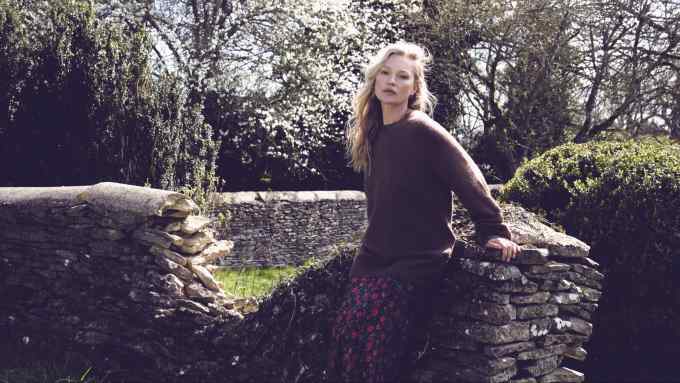 Kate Moss wears Margaret Howell jumper and Réalisation Joni skirt