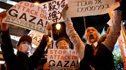 People hold a rally to protest against Israel’s attack on Gaza near the Israeli embassy in Tokyo