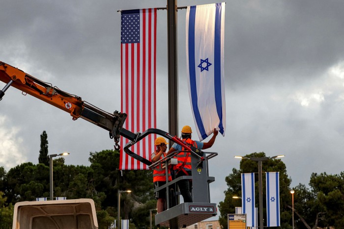 Flags of Israel and the US are hung up in Jerusalem ahead of Joe Biden’s upcoming visit to Israel 