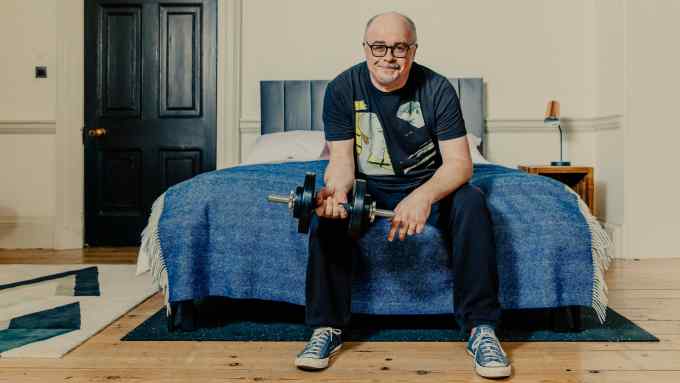 The author sits on the Pivot bed and home gym, from £2,999