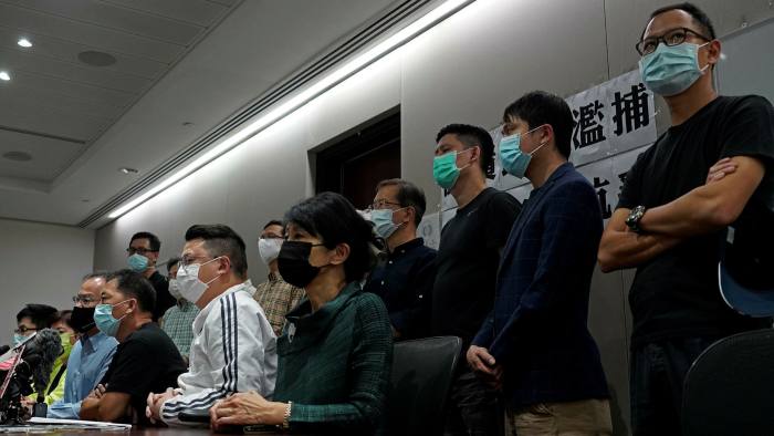 Pro-democracy legislators attend a press conference in Hong Kong on Sunday