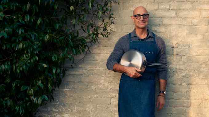Stanley Tucci holds the GreenPan stainless-steel 26cm sauté pan, £229.95
