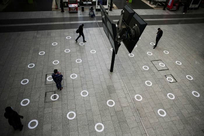 Social distancing markers on the concourse of Gare du Nord railway station in Paris