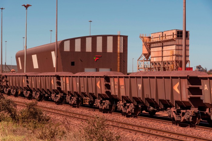 Railway wagons carrying iron ore for export at Saldanha Bay