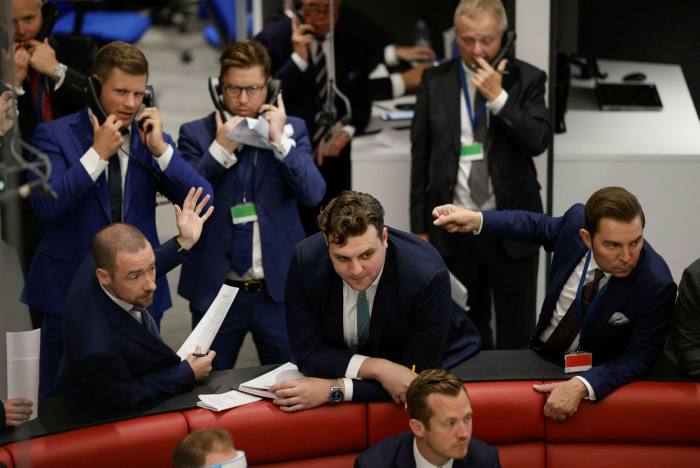 Traders on the trading floor of the open outcry pit at the London Metal Exchange