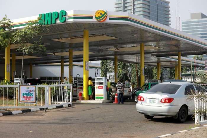 Cars queue to buy petrol at the NNPC Mega petrol station in Abuja, Nigeria