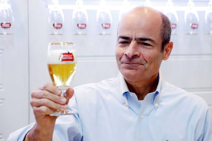 Carlos Brito, ABI’s chief executive, poses with a Stella Artois