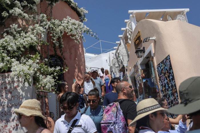 Tourists in the streets of Oia, Santorini