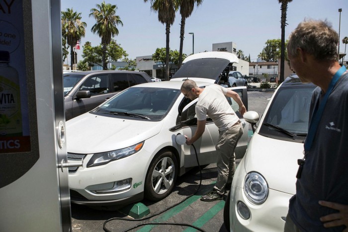 Drivers plug in at a Volta Industries electric charging station in Los Angeles, California