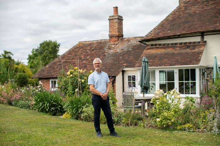 Peter Bell in the garden of his listed property in Kent