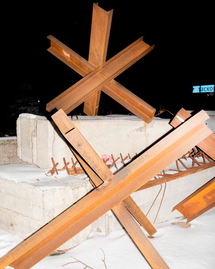 Concrete blocks with large wooden cross-shapes on top