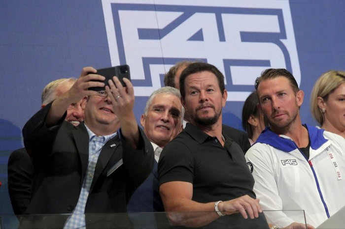 Actor Mark Wahlberg and Adam Gilchrist, founder and former CEO of fitness chain F45 Training, attend the company's IPO on the New York Stock Exchange in July 2021