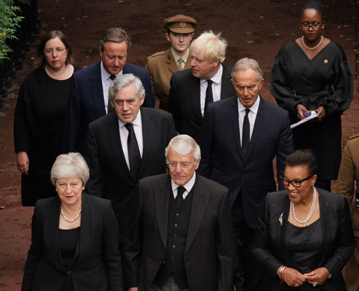 (Front L to R) Britain’s former Prime Ministers Theresa May, John Major, and Baroness Scotland, (Second row from L to R) Britain’s former Prime Ministers Gordon Brown, Tony Blair, (third row from L to R) Britain’s former Prime Ministers David Cameron and Boris Johnson, arrive for the Accession Council i