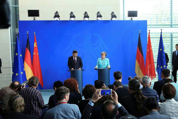 Xi Jinping, left, and Germany’s Angela Merkel: will there be more substance in side deals struck directly between China and EU governments?