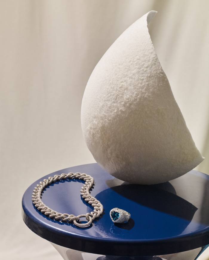 From left: Pomellato white-gold and diamond La Gioia Catene necklace. Gucci white-gold, diamond and heart-shaped blue-tourmaline Hortus Deliciarum solitaire ring