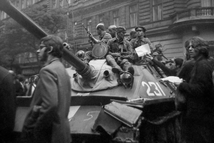 People in Prague block Soviet Union troops and tanks in 1968