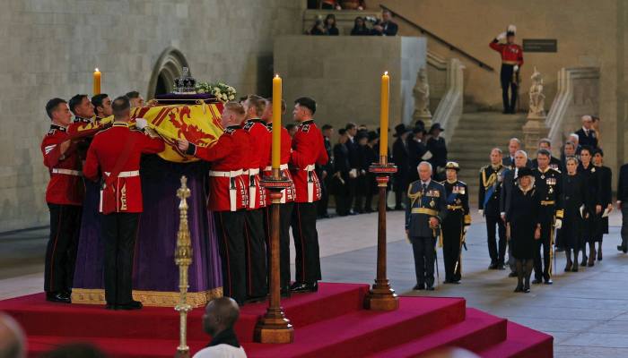 The bearer party of guardsmen carries the coffin of Queen Elizabeth II into Westminster Hall