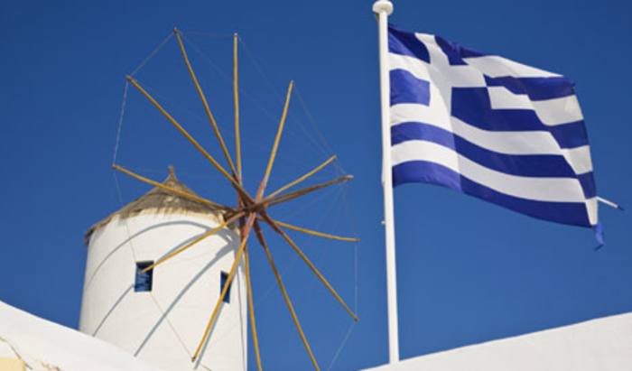 Greece’s “unsustainable” debt commitments prompt downgrade