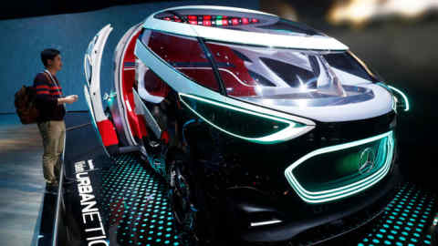 A man looks over the Mercedes-Benz Vision URBANETIC autonomous vehicle during the 2019 CES in Las Vegas, Nevada, U.S. January 8, 2019. REUTERS/Steve Marcus