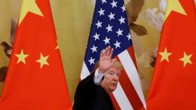 FILE PHOTO: U.S. President Donald Trump waves during joint statements with China's President Xi Jinping at the Great Hall of the People in Beijing, China, November 9, 2017. REUTERS/Thomas Peter/File Photo