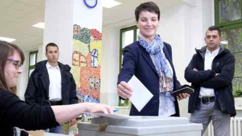 Head of the anti-migrant Alternative for Germany, or AfD, Frauke Petry casts her vote in the German parliament election at a polling station in Leipzig, eastern Germany, Sunday, Sept. 24, 2017. Chancellor Angela Merkel is widely expected to win a fourth term in office as Germans go to the polls. (Sebastian Willnow/dpa via AP)